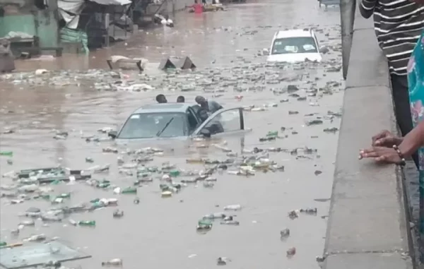 Three men rescued as flood sinks car in Agege (Video)