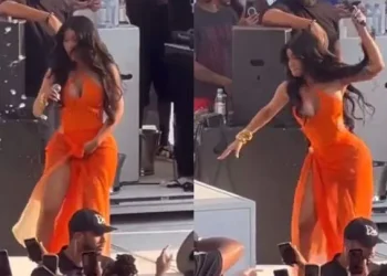 Rapper Cardi B now a suspect in battery case after she threw a microphone at a fan who hurled a drink at her on stage